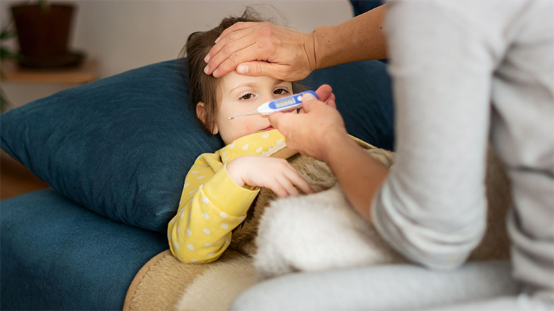 babysitter helping sick girl